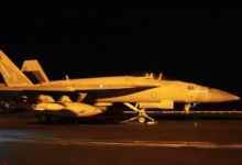 US strikes bridges and collapses a tower at a key port as its Iran campaign expands