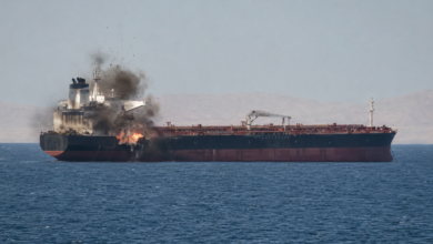Strait of Hormuz vessel attack showing a commercial ship hit by an unknown projectile