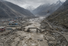 Nepal floods 2026 showing severe destruction in a Himalayan river valley, damaged bridges, debris and rescue operations