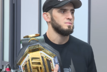Islam Makhachev UFC record holder with UFC championship belt