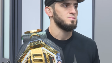 Islam Makhachev UFC record holder with UFC championship belt