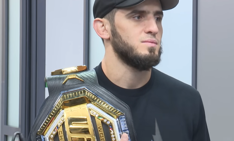 Islam Makhachev UFC record holder with UFC championship belt